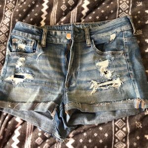 Ripped medium wash American eagle shorts